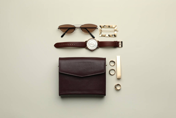 Stylish woman's bag and accessories on light background, flat lay - Fotoğraf, Görsel