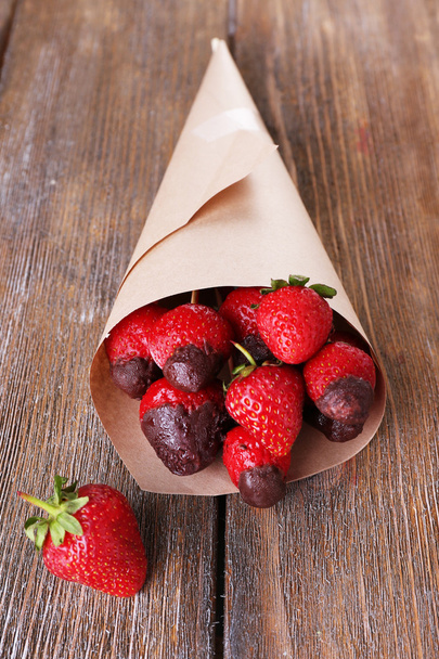 Strawberry in chocolate on skewers - Фото, изображение