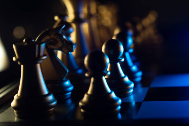 A closeup shot of chess pieces on dark background - Foto, immagini