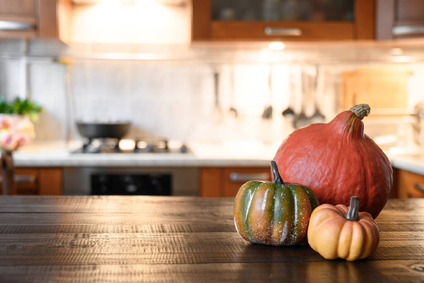 Cozy kitchen with pumpkins for Thanksgiving day or Halloween cooking. - Fotó, kép