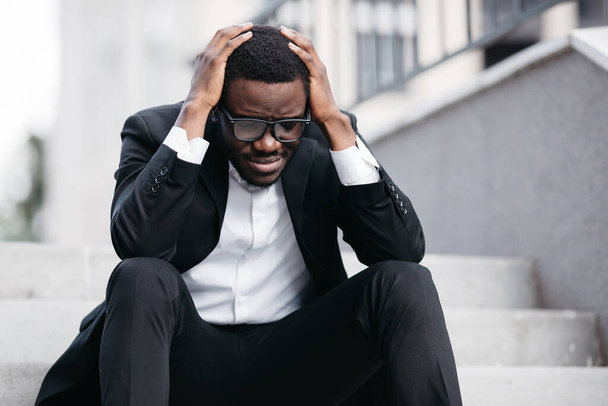 Portrait of worried businessman sitting after losing job, stressed concept - Foto, Imagen
