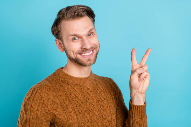 Photo of happy cheerful positive young man make v-sign smile isolated on pastel blue color background - Φωτογραφία, εικόνα