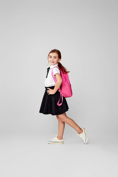 adorable schoolgirl with backpack. Back to school - Valokuva, kuva
