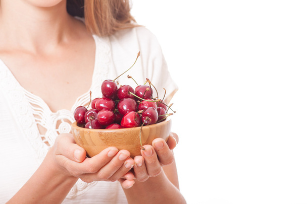bowl of cherries in womens hands - Φωτογραφία, εικόνα
