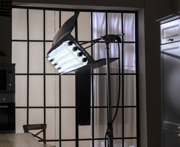 The professional studio lights on a black background. Studio lighting equipment. - Photo, Image