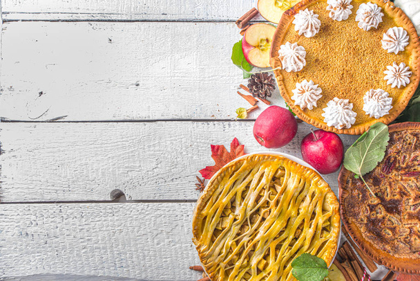 Traditional fall baking. American and Europe traditional autumn winter cakes - with pumpkin, pecan and apple  - Fotó, kép