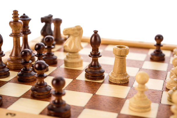 Beige Brown Wooden chess different pieces igures standing on chessboard. Close up game concept competition, Classic Tournament. - Photo, Image