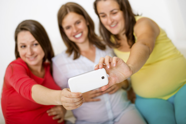 Pregnant women taking selfie - Photo, image