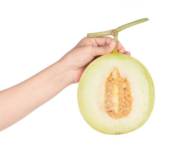 hand holding Ripe Melon Cantaloupe slice, isolated on white background. - Foto, imagen