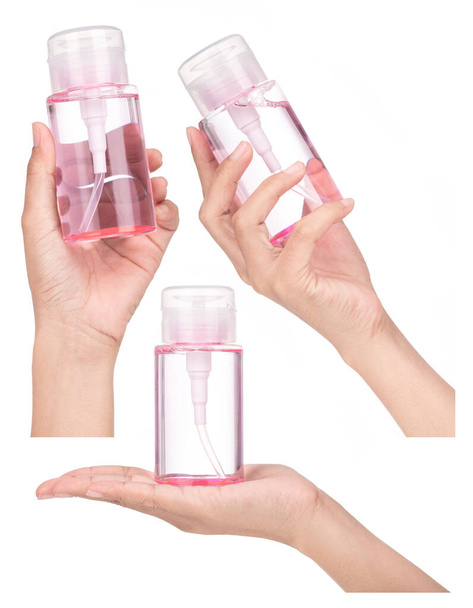 Colección de mano que sostiene el agua de limpieza del removedor de maquillaje aislada sobre fondo blanco. - Foto, Imagen