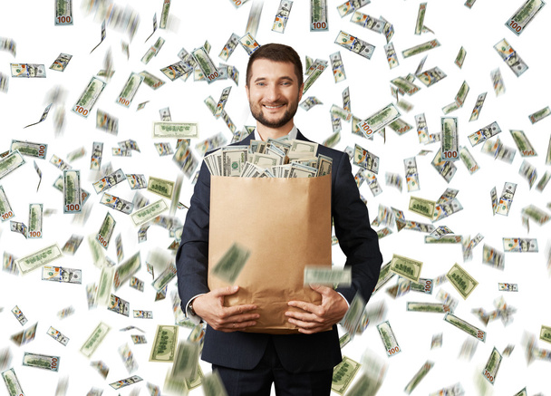 sonriente hombre de negocios con dinero
 - Foto, Imagen
