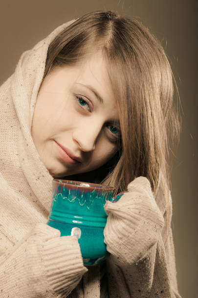 Girl holding cup mug of hot drink tea or coffee - Zdjęcie, obraz