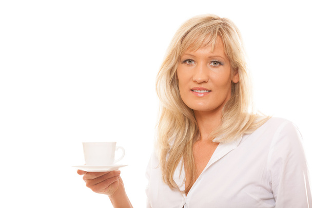 Mature woman drinking tea or coffee - Fotografie, Obrázek