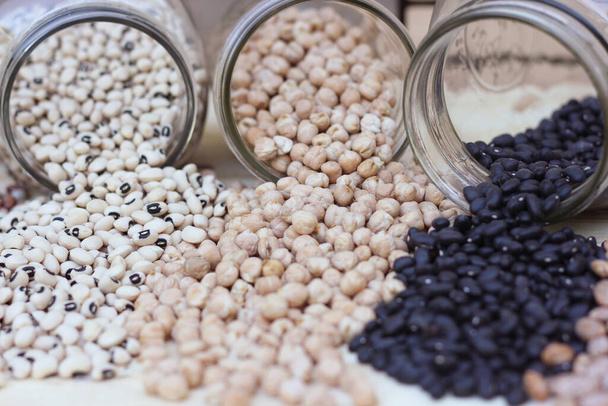 Black-eyes Peas, Chick Peas, Black Beans and Pinto Beans Spilled in Kitchen - Фото, изображение