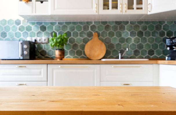 blurred kitchen interior and wooden desk space home background - Foto, Bild
