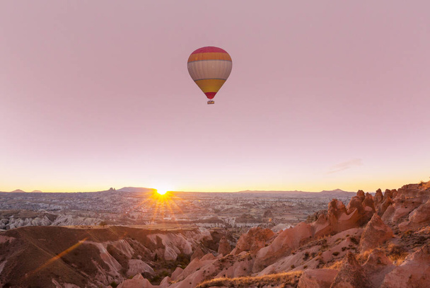 Colorful hot air balloons  in Goreme national park, Cappadocia, Turkey. Famous touristic attraction. - Photo, Image