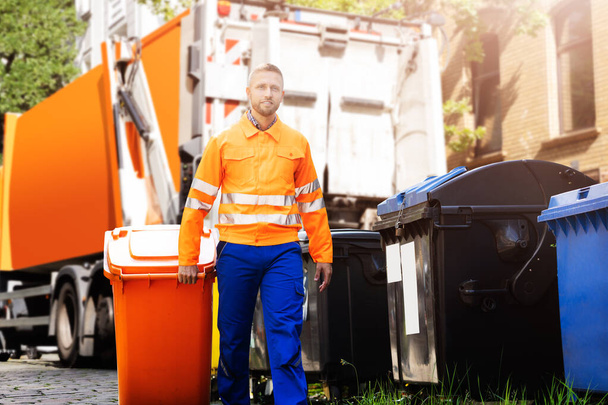 Garbage Removal Man Doing Trash And Rubbish Collection - Foto, immagini
