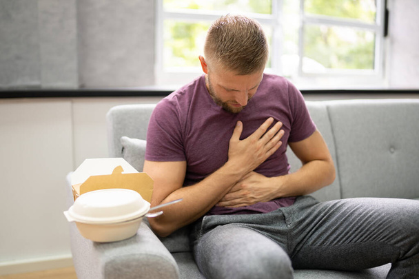 Unhealthy Fastfood Stomach Heartburn. Person After Eating Food - Zdjęcie, obraz