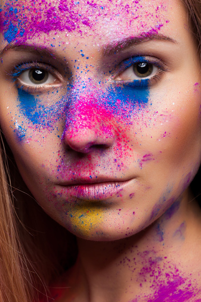 Woman with color powder on face fashion make up - Foto, Imagem