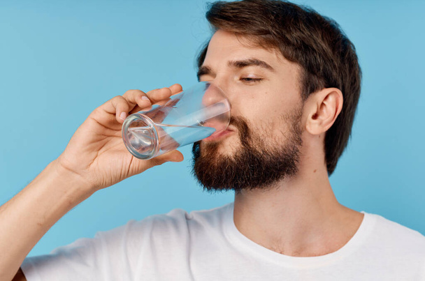 bearded man drinking water on  isolated background. High quality photo - Foto, Imagen