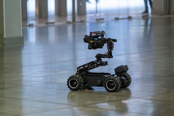 Unmanned vehicle with camera driving on floor - Photo, Image