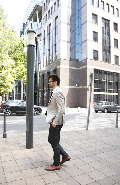 Modern broker in front of stock exchange - Foto, Imagen