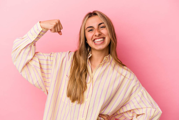 Young blonde caucasian woman isolated on pink background cheering carefree and excited. Victory concept. - Valokuva, kuva