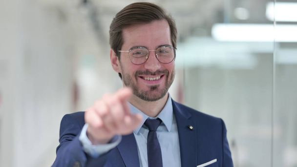 Portrait of Assertive Young Businessman Pointing at the Camera - Fotografie, Obrázek