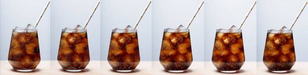 rum with cola and ice in a glass close-up, cola with ice. summer drink - Photo, Image