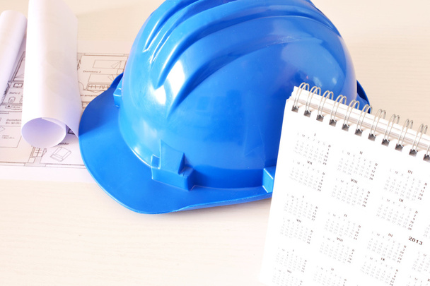 Helmet and tools for construction drawings - Photo, Image