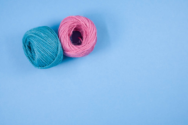 A top view of a colorful thread rope yarn on a blue background - Fotografie, Obrázek