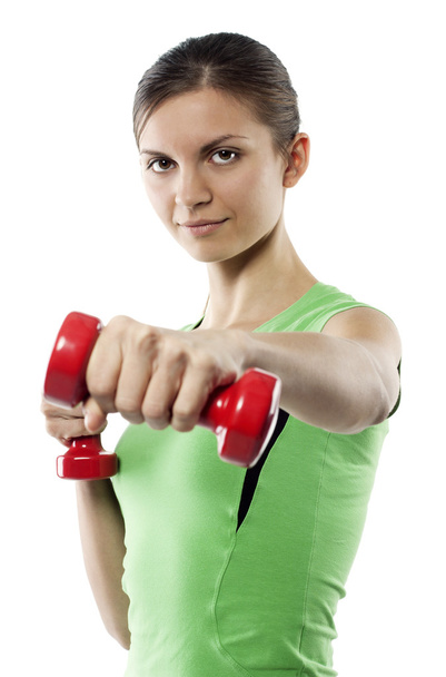 The girl with dumbbells in the hands - Photo, image
