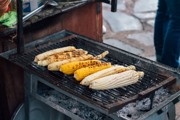 Corn on the cob grilling at street market - Photo, Image