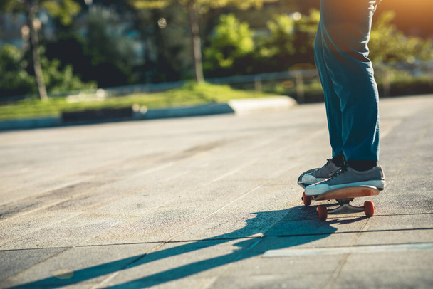 Skateboarder skateboarding outdoors in city - Fotó, kép