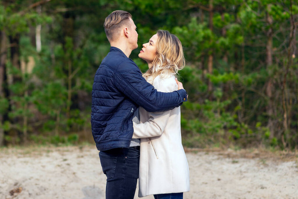 Happy loving couple enjoying in moments of happiness in the park. Love tenderness,dating, romance. Lifestyle concept.Young couple lover dating and hugging in love at spring park.Romantic love concept - Fotoğraf, Görsel
