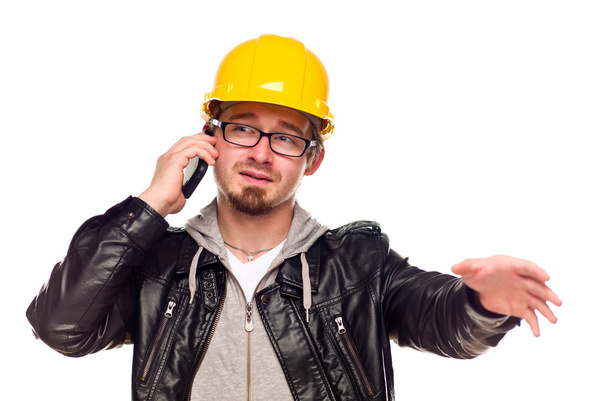 Handsome Young Man in Hard Hat on Phone - Photo, Image