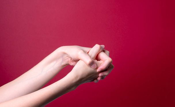 woman holds her hand - pain concept - Fotografie, Obrázek