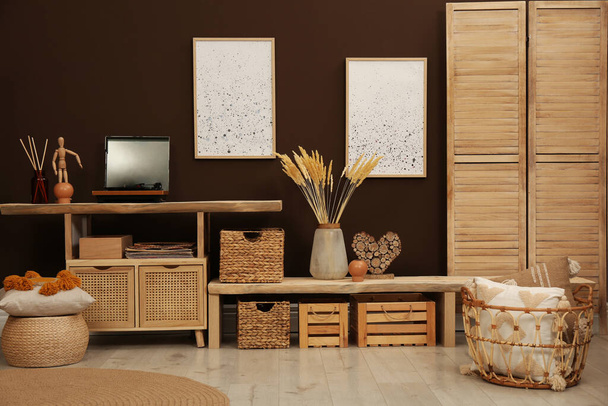 Trendy boho style furniture and decor in room. Interior design - Fotoğraf, Görsel