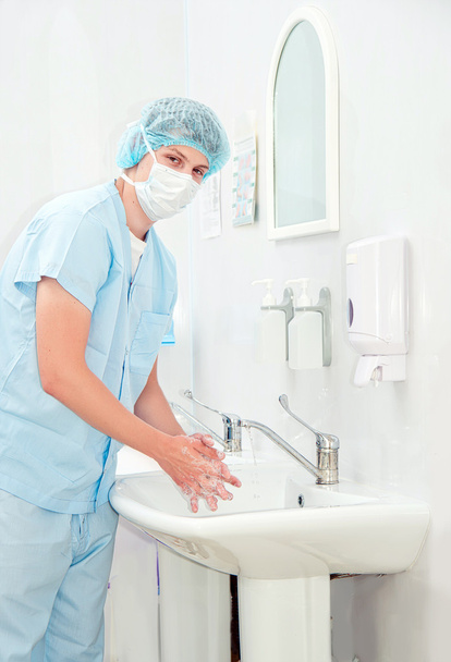 Surgeon washing hands before operation - Фото, изображение