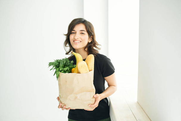 cheerful brunette food bag cooking healthy food - Φωτογραφία, εικόνα