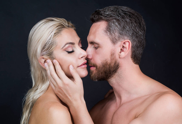 sexy couple in love of woman and man with naked body kiss, desire - 写真・画像