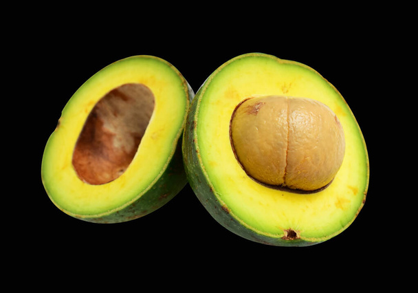 Fresh avocado fruit isolated with clipping path, half, slices or pieces avocado no shadow black background - Photo, Image