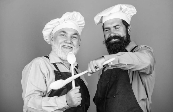 The nutritional choice. taste food. culinary concept. mature senior bearded men in kitchen. new recipe. Perfect taste. professional restaurant cook. Chef men cooking. cheerful men prepare food - Photo, Image