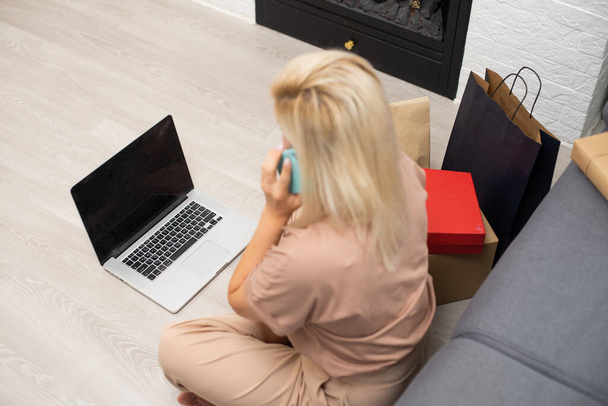 Happy woman doing online shopping at home, black friday - Photo, Image
