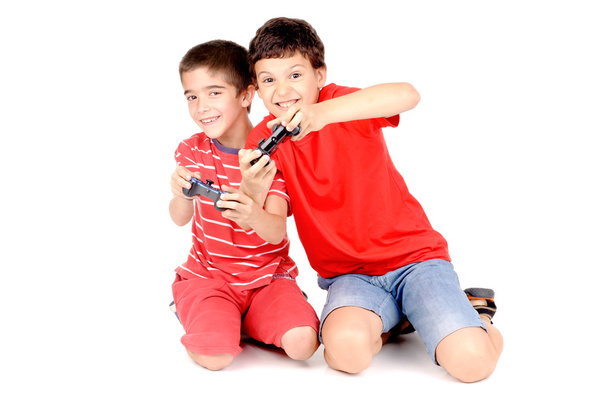 Boys playing video games - Foto, afbeelding