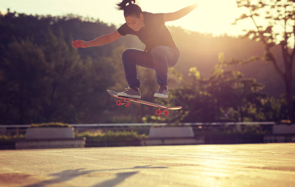Skateboarder skateboarding outdoors in city - Fotó, kép