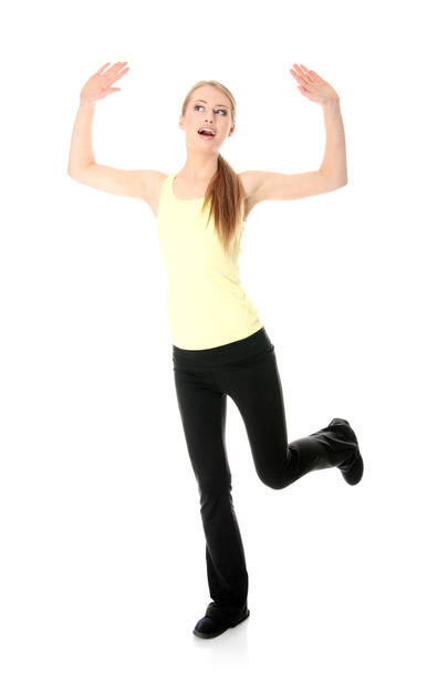 Young woman doing exercise - Фото, зображення