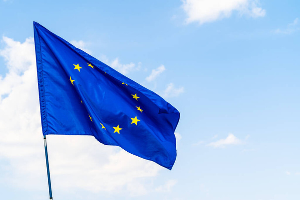 European Union flag against blue sky waving - Fotografie, Obrázek