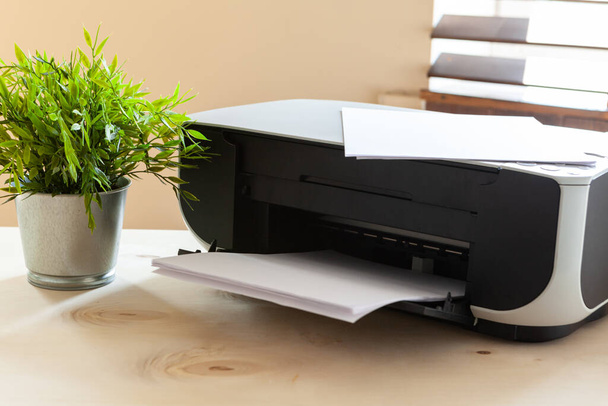 Close up of an office table with printer on it - Foto, imagen