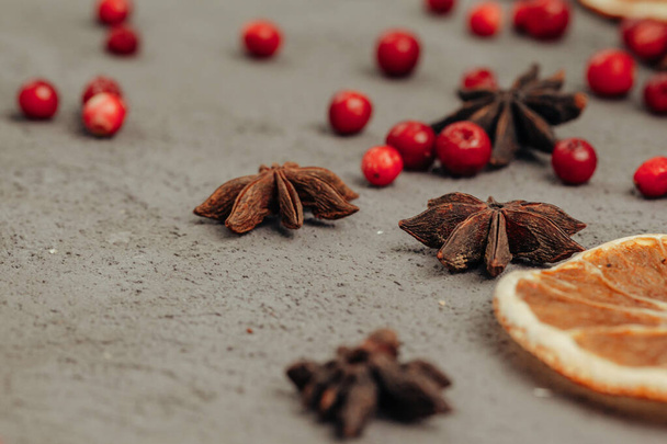 Berries and spices for mulled wine cooking close up on kitchen table - 写真・画像